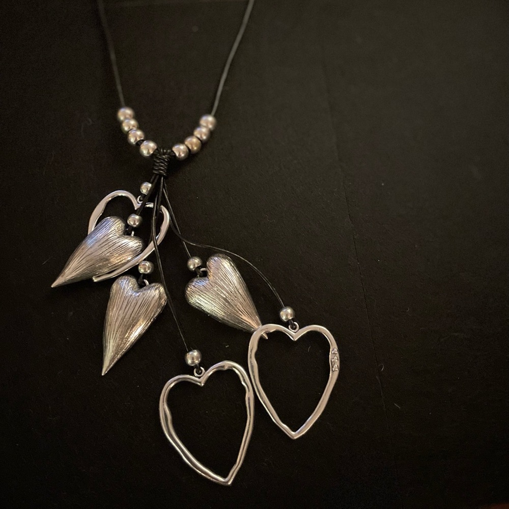 Silver hearts on black cord